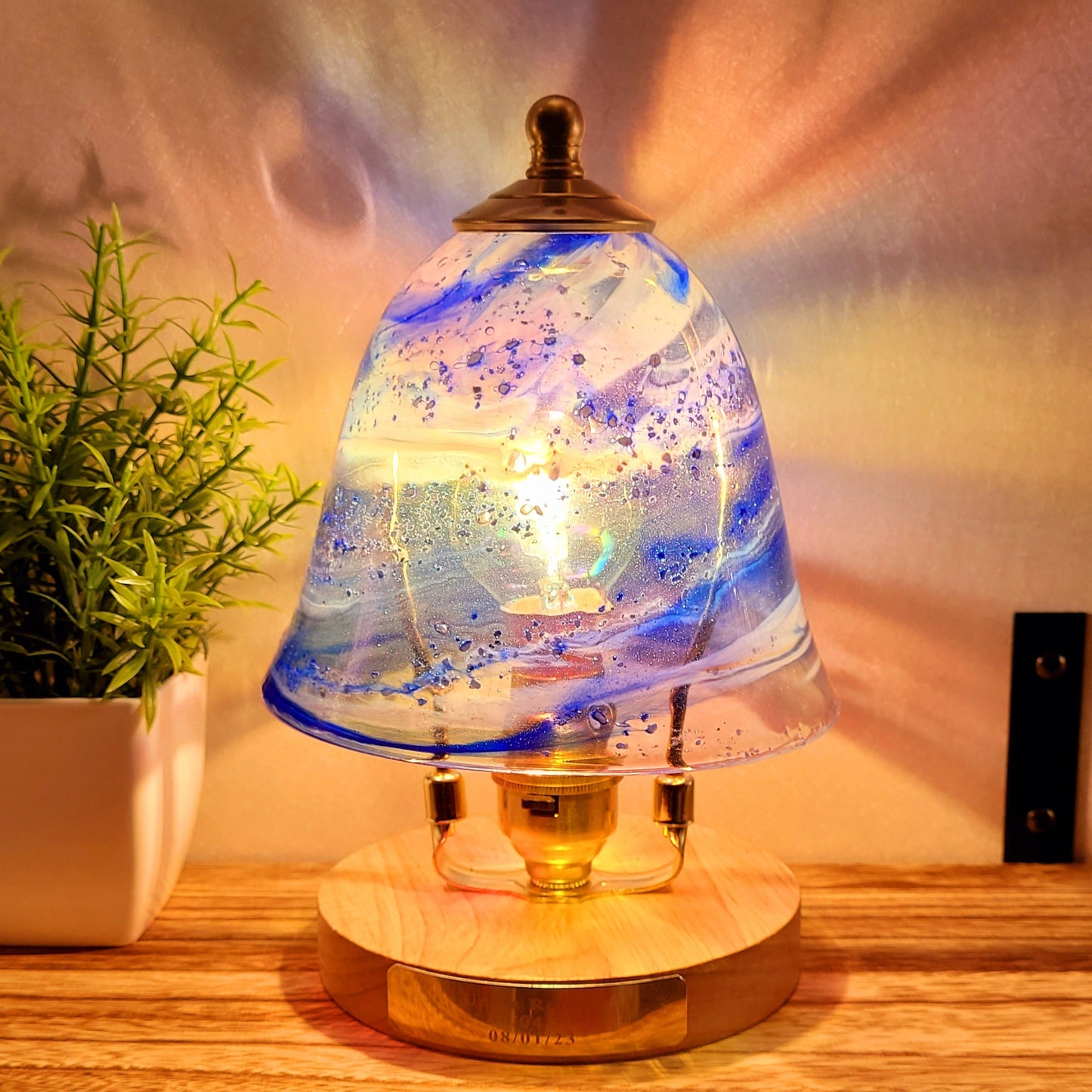 Ashes in glass table lamp
